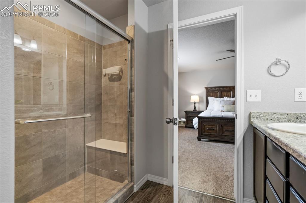 Image 29 of 45: The shower even has a bench,. 