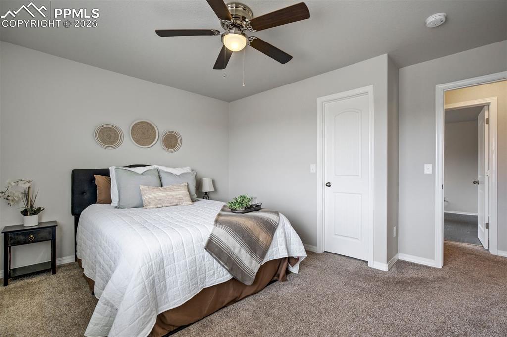 Image 31 of 45: Bedroom 2 upstairs for guest room, hobby haven, or the backup plan for when