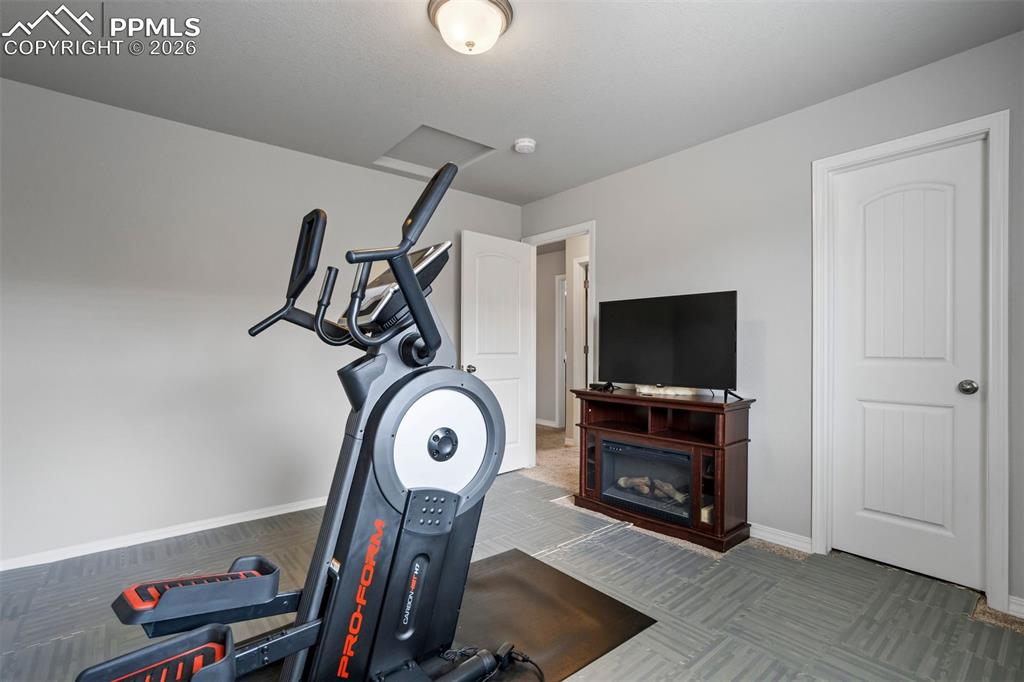 Image 34 of 45: Third bedroom is currently flexing as a home gym—literally.