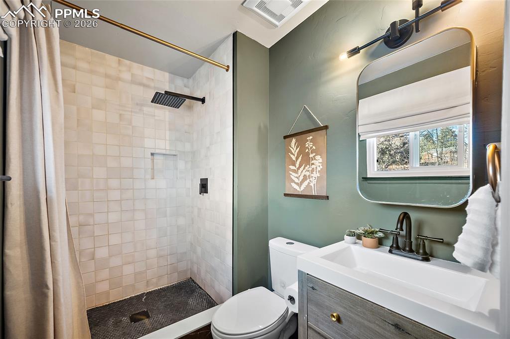 Image 21 of 45: Primary bedroom featuring light colored carpet, burgundy walls