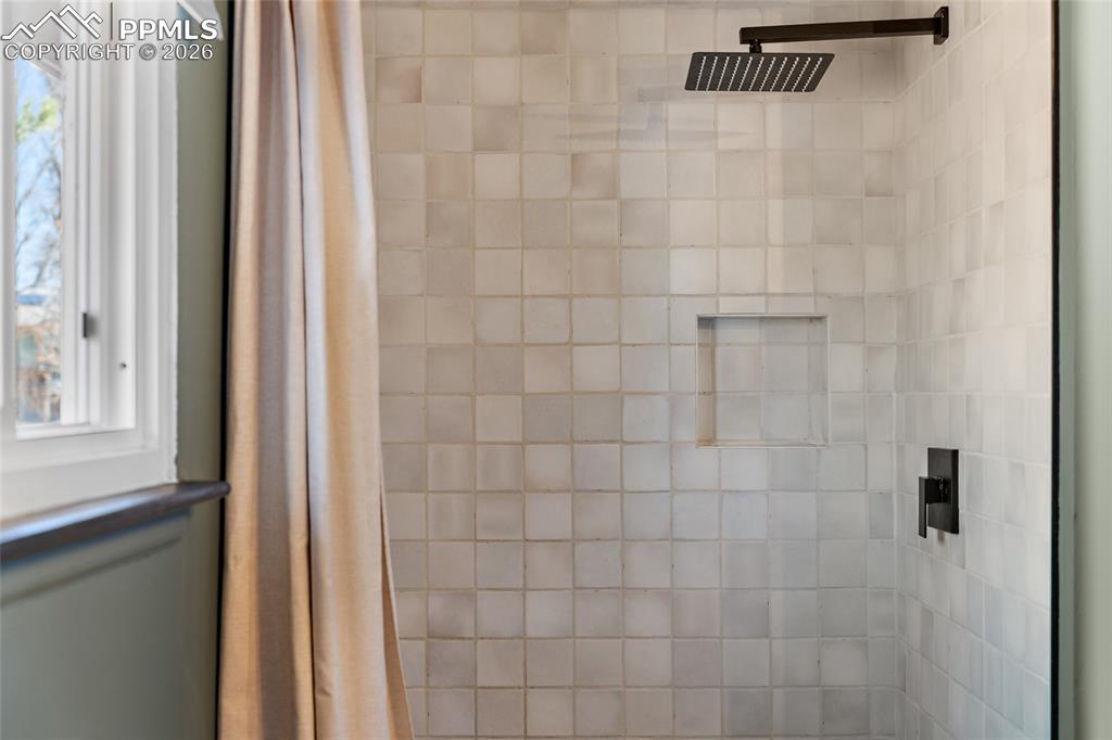 Image 22 of 45: Primary bedroom with light colored carpet