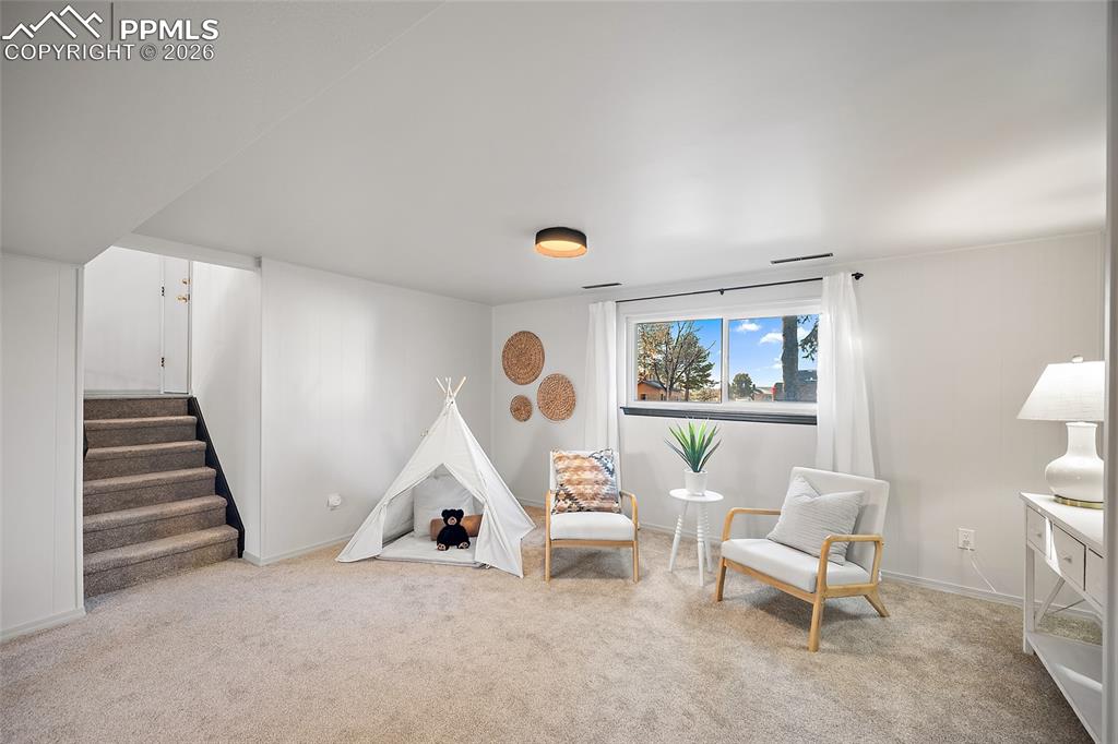 Image 27 of 45: Bedroom with a closet and light colored carpet