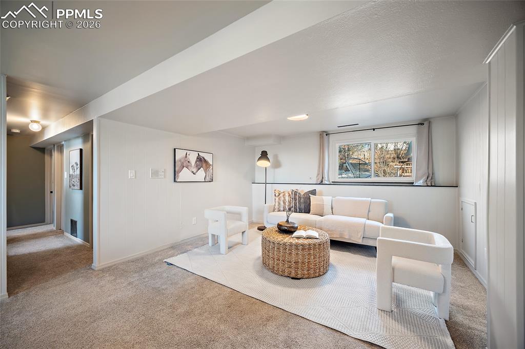 Image 28 of 45: Upper level full bath featuring vanity and shower / bathtub combination wit