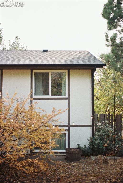 Image 39 of 45: Back of house with a fenced backyard and a patio area