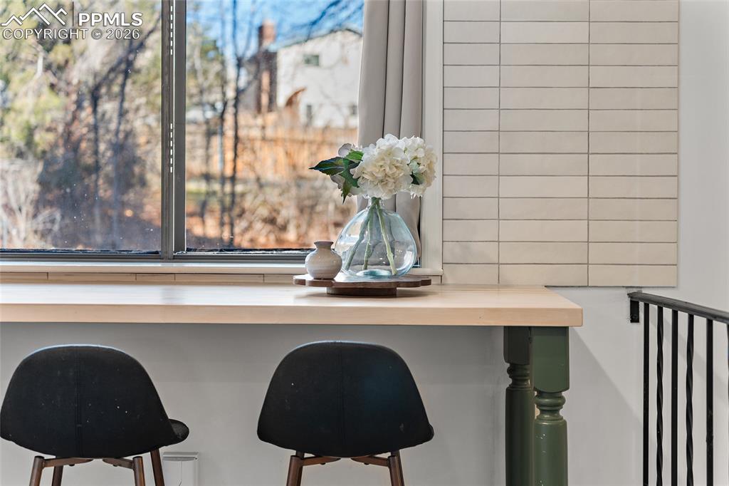 Image 8 of 45: Kitchen view of green cabinets, dishwasher, and white cabinetry