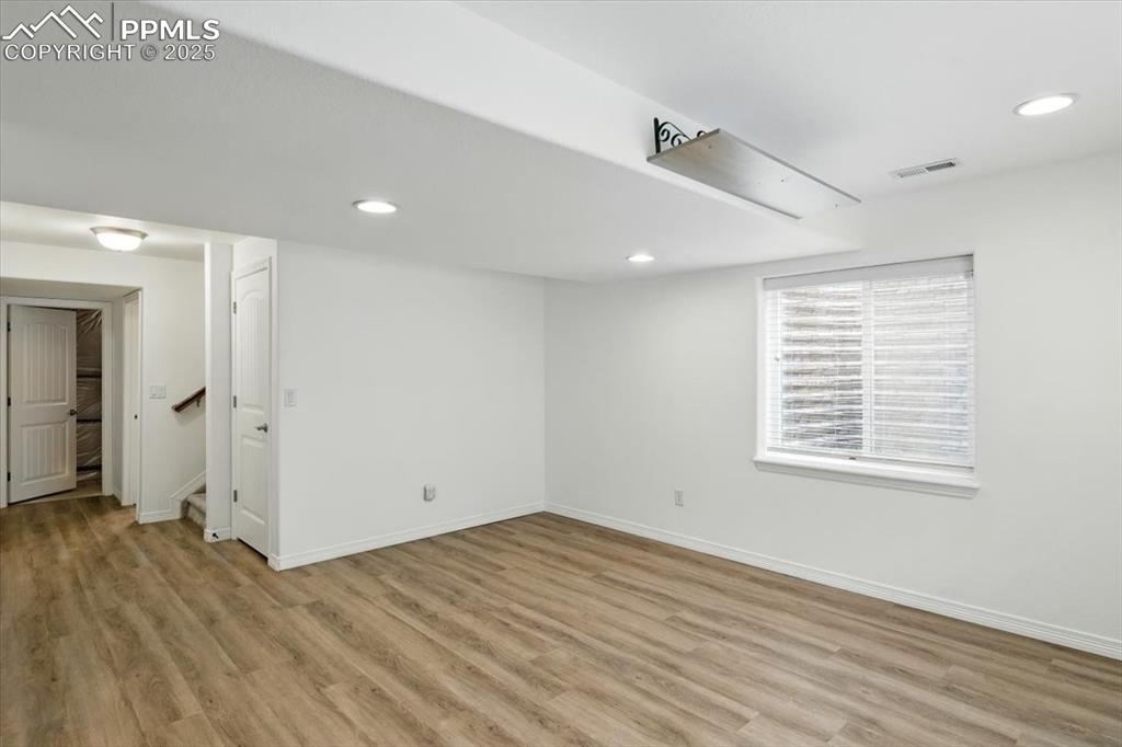 Image 32 of 46: Office or dining space featuring wood finished floors and baseboards