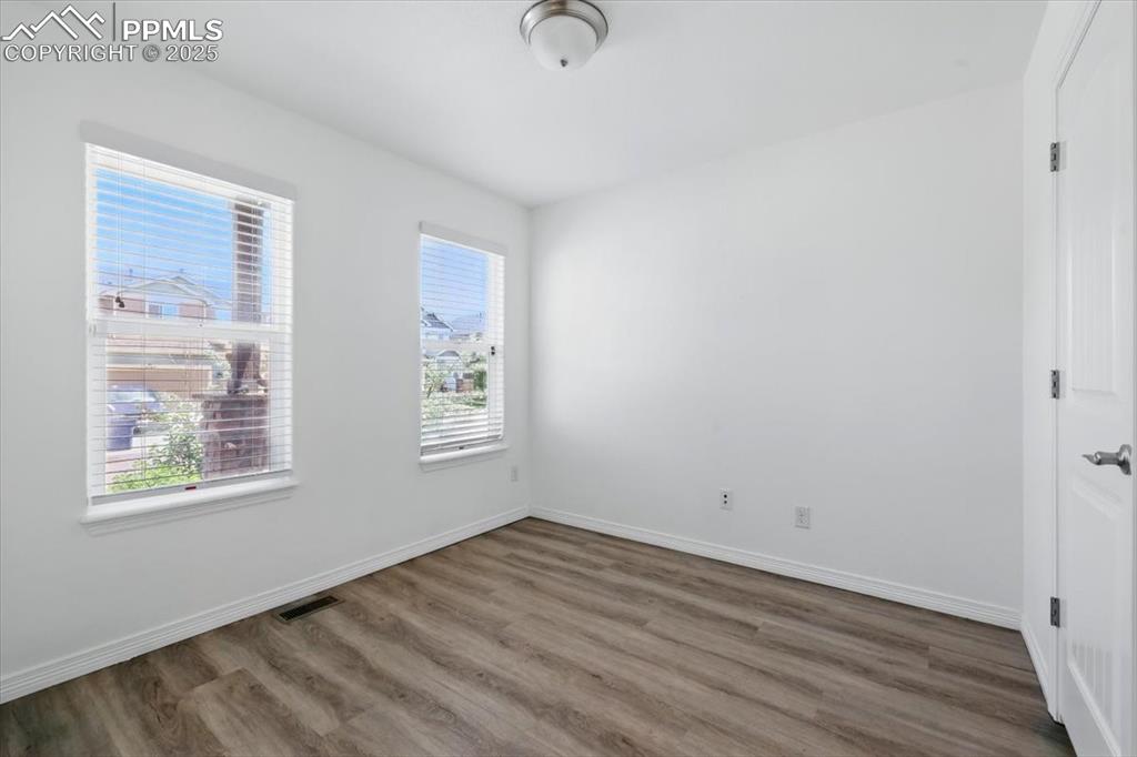 Image 4 of 46: Office or dining space featuring wood finished floors and baseboards