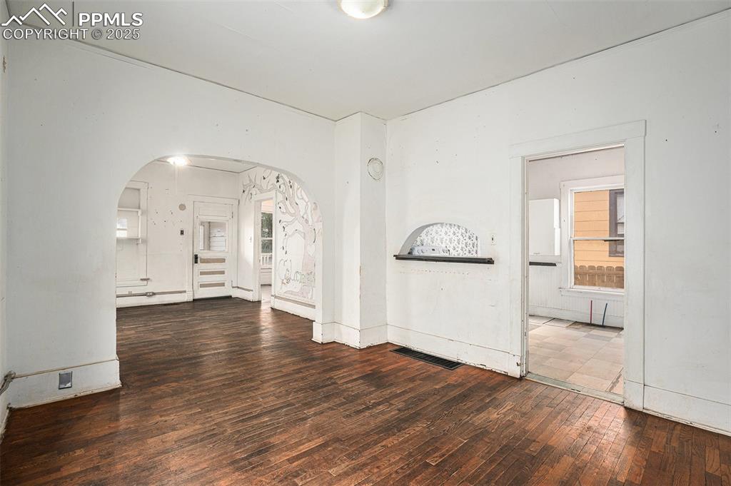 Image 3 of 12: Large dining area with hardwood floors