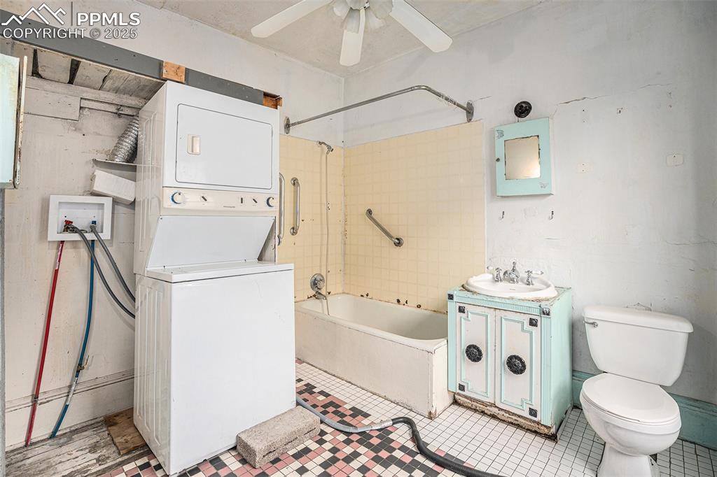 Image 7 of 12: Full bathroom with laundry space