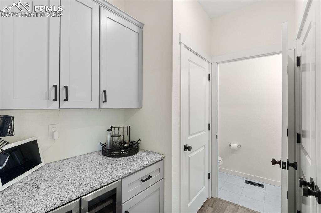 Image 13 of 43: Custom coffee/drink bar on main level