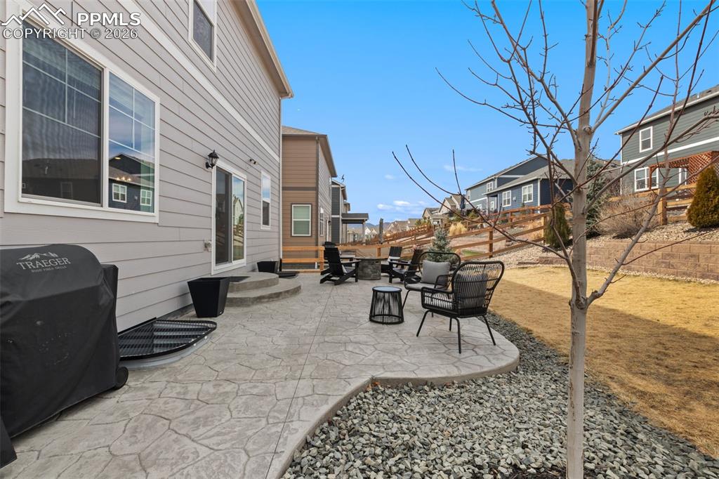 Image 34 of 43: Custom landscaping and large stamped concrete patio