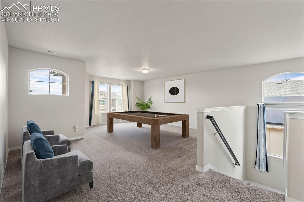 Image 27 of 50: Virtually staged. Game room featuring carpet and pool table