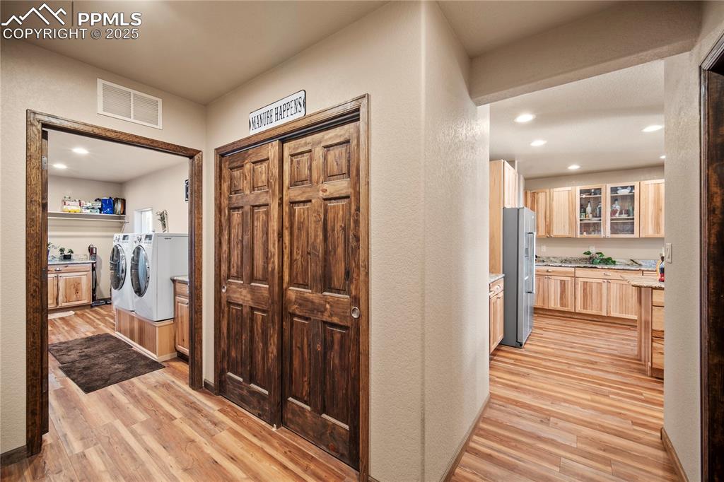 Image 10 of 49: Laundary with wash station and abundant counter space