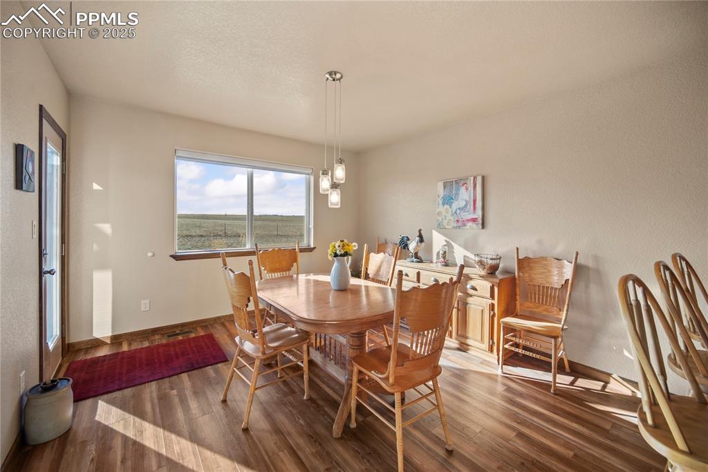 Image 14 of 49: Choose between the formal dining room or a cozy breakfast nook for entertai