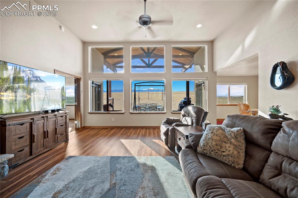Image 6 of 49: floor-to-ceiling windows offering panoramic mountain views