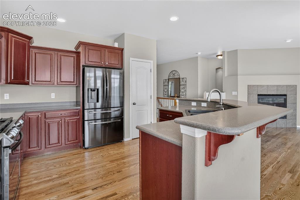 Image 10 of 45: Beautiful Open concept kitchen with Corian counters.