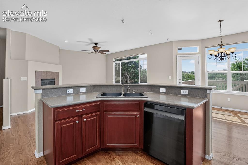 Image 11 of 45: Kitchen equipped with stainless appliances, double oven & gas range