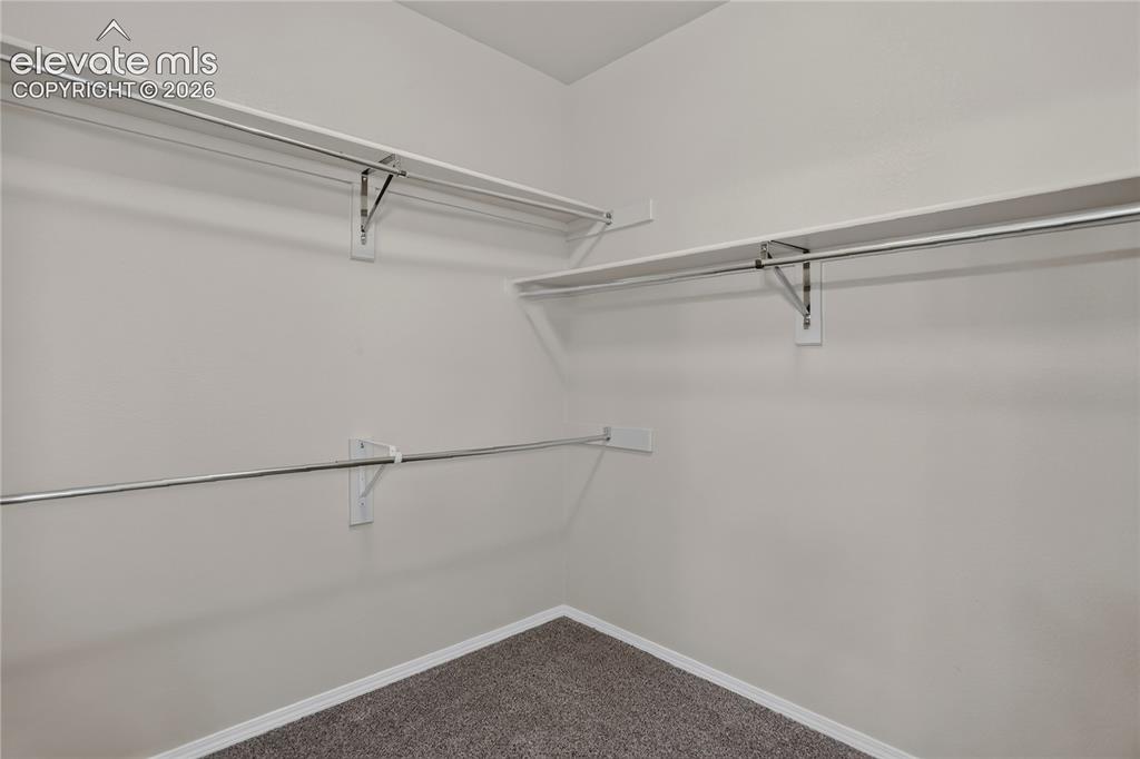 Image 24 of 45: Primary Closet is roomy for all your clothes