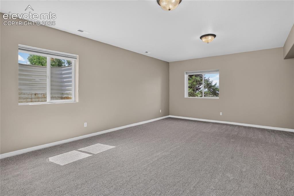Image 25 of 45: Basement family room is big enough for games and entertaining