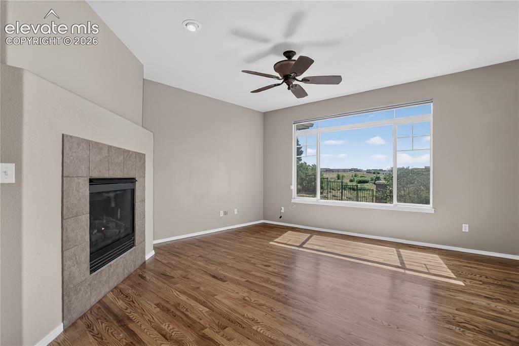 Image 6 of 45: Great room has surround sound wiring and programmable motorized opener for