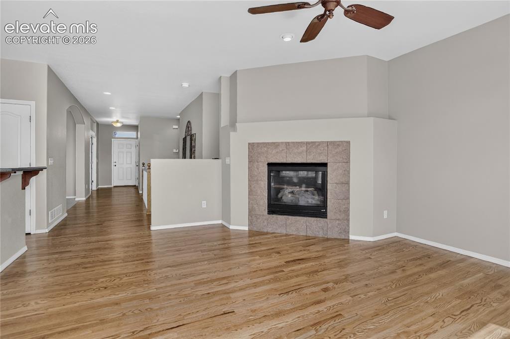 Image 9 of 45: Cozy gas fireplace in the great room to enjoy Colorado winters!