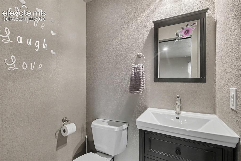 Image 15 of 45: Conveniently located half bath with a clean, welcoming design—perfect for g