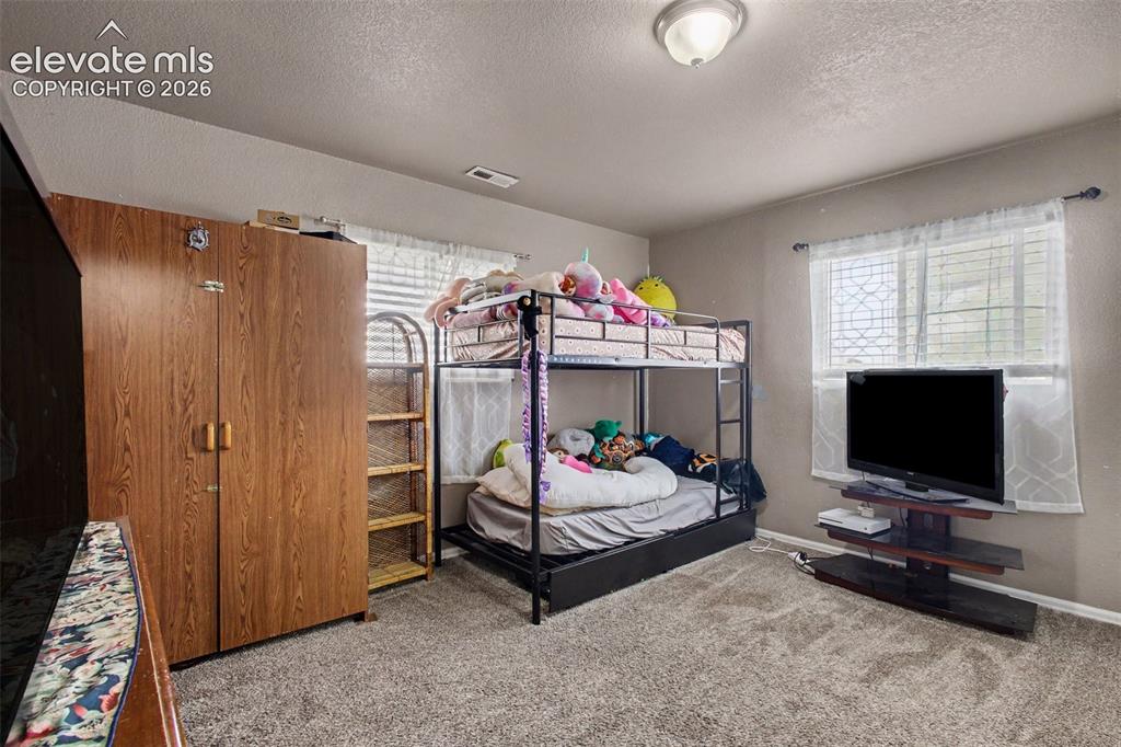 Image 21 of 45: Versatile 4th bedroom offering a comfortable retreat with plenty of potenti