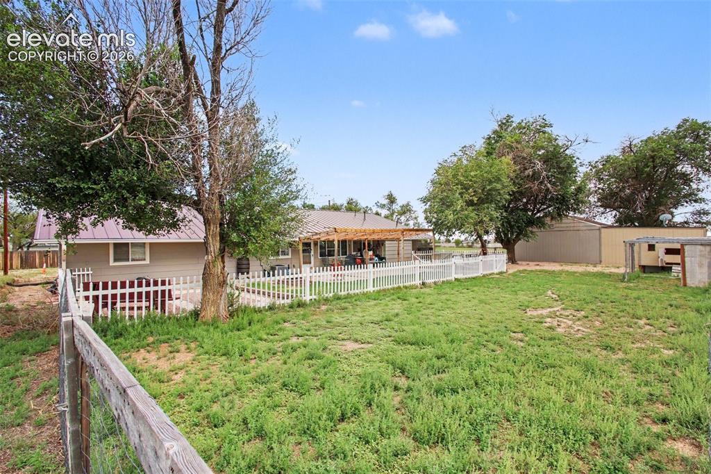 Image 27 of 45: Expansive fenced backyard offering privacy, plenty of room to enjoy the ope