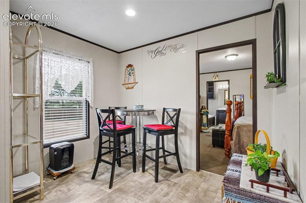 Image 32 of 45: 2nd Home: Bright and inviting dining area with an open layout, creating a c