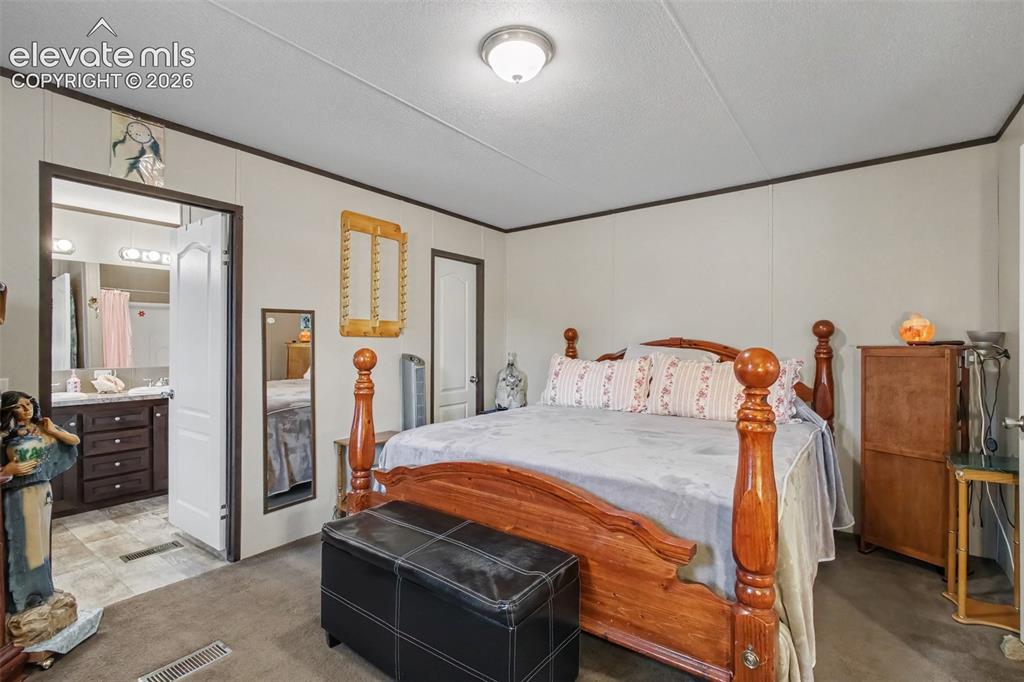 Image 33 of 45: 2nd Home: Comfortable and inviting primary bedroom with direct access to th