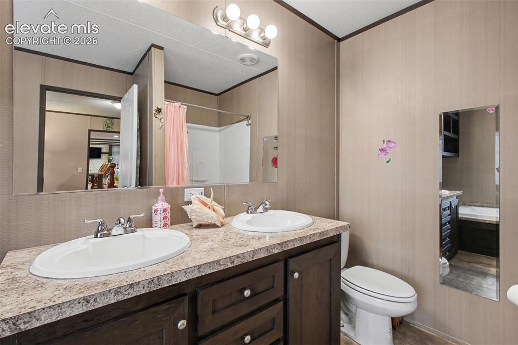Image 34 of 45: 2nd Home: Beautifully designed 5-piece bathroom featuring dual sinks and a