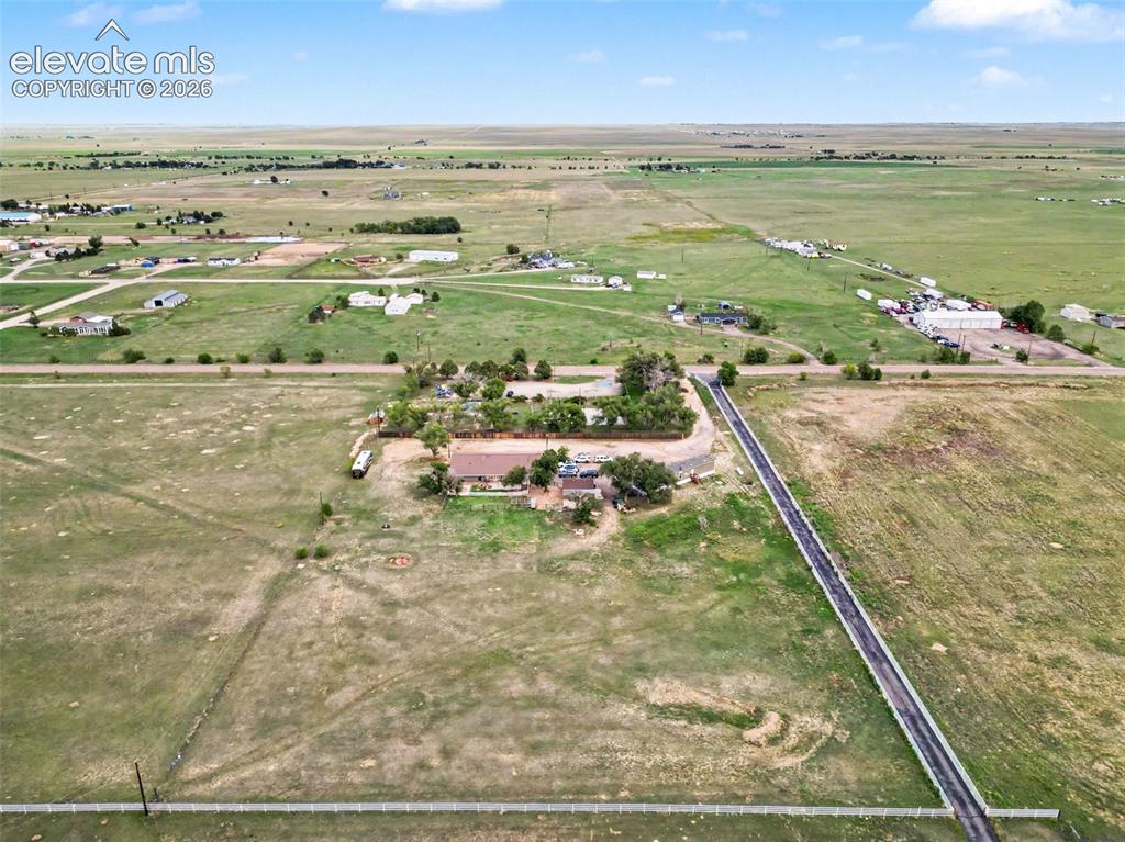 Image 43 of 45: Rear view showcasing the impressive size of the property, expansive open sp