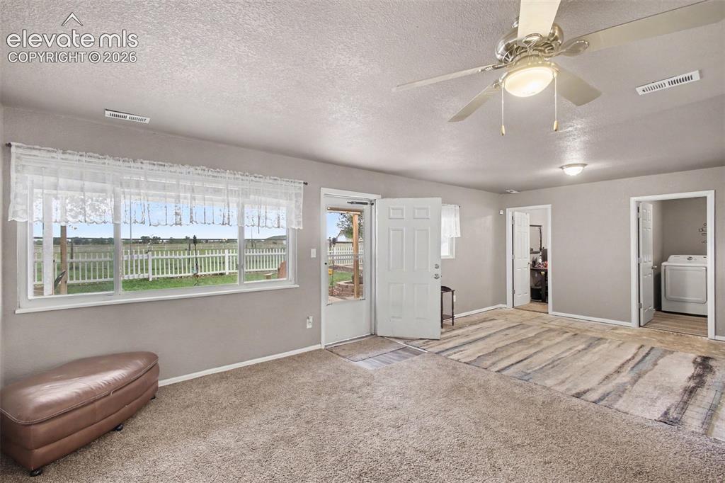 Image 6 of 45: Inviting 2nd living room featuring a walkout to the back patio, creating an