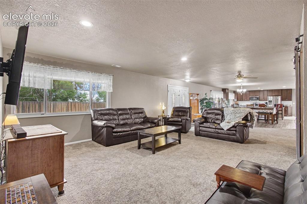 Image 8 of 45: Welcoming living room just off the entry, featuring an open-concept layout