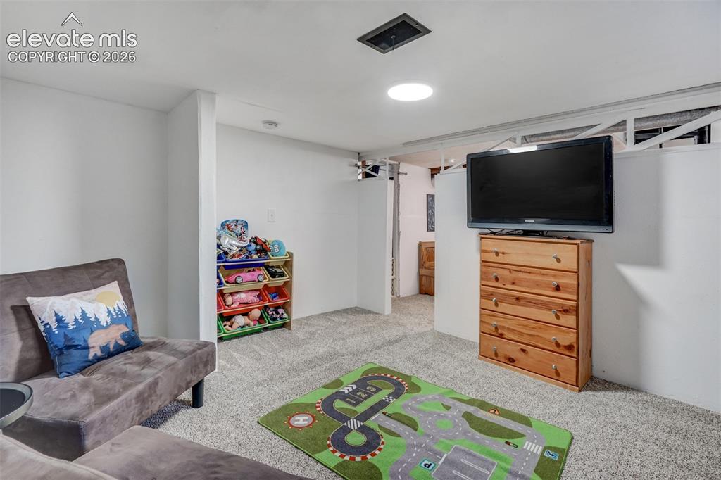Image 40 of 41: Carpeted flooring, recessed lighting, and white walls