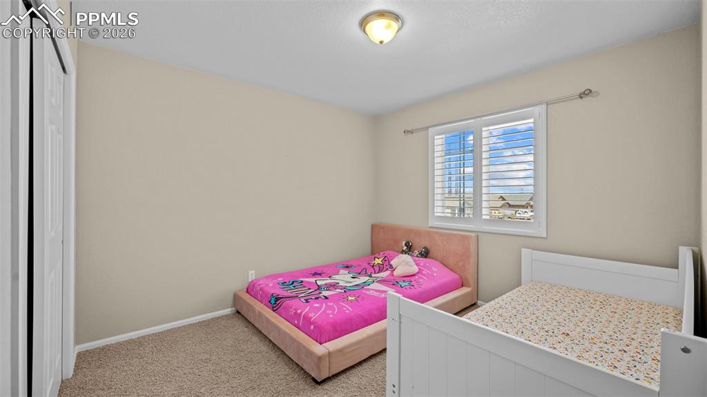 Image 20 of 37: Living room with light carpet and baseboards