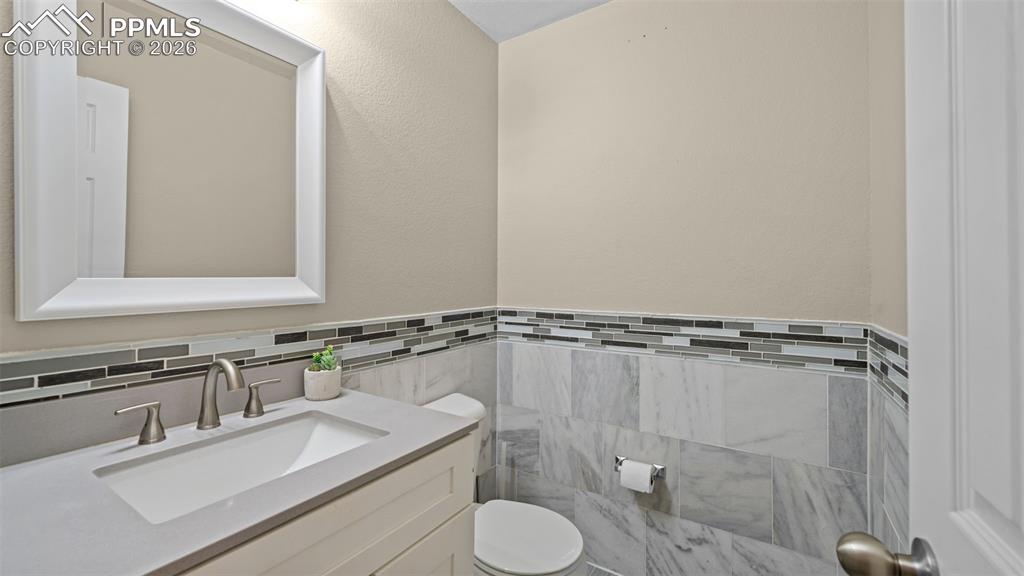 Image 23 of 37: Bedroom with light colored carpet and a closet