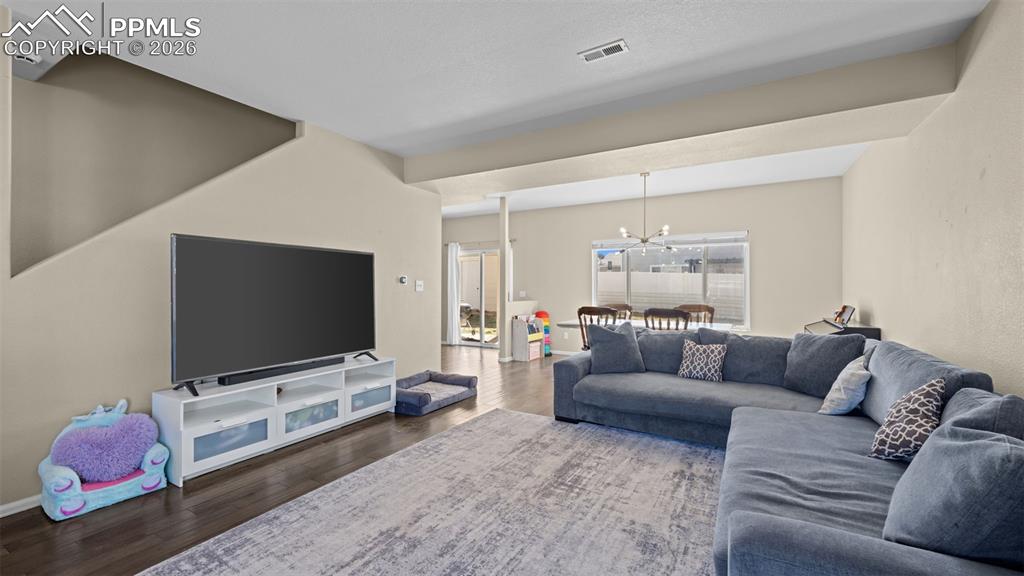 Image 33 of 37: Kitchen with stainless steel appliances, wood finish cabinetry, light count