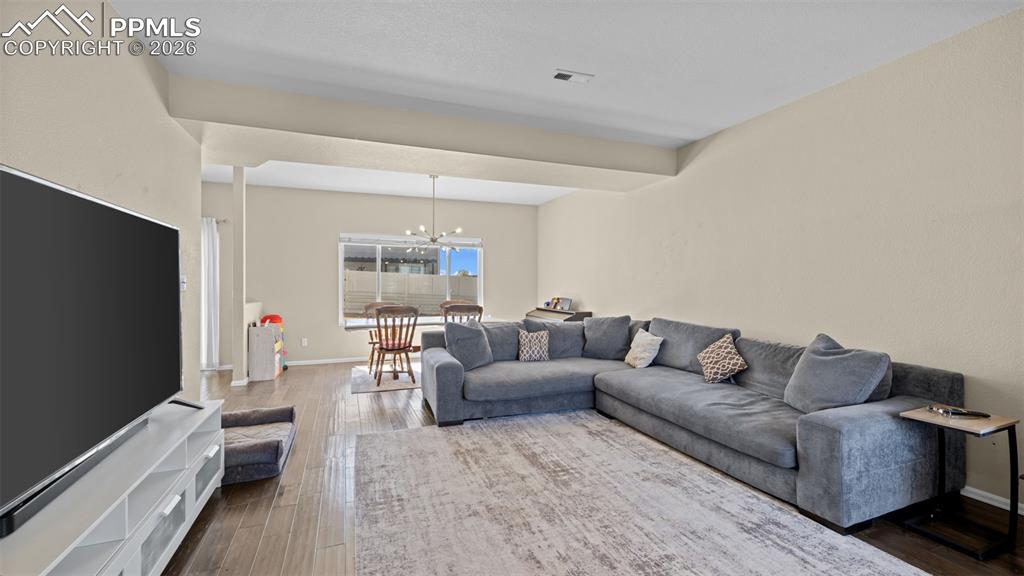 Image 34 of 37: Kitchen featuring light countertops, wood finish cabinets, black appliances