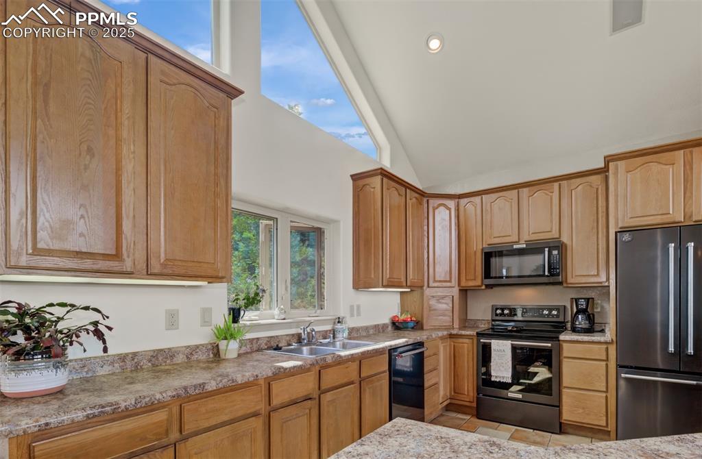 Image 14 of 46: Another view of the spacious kitchen!