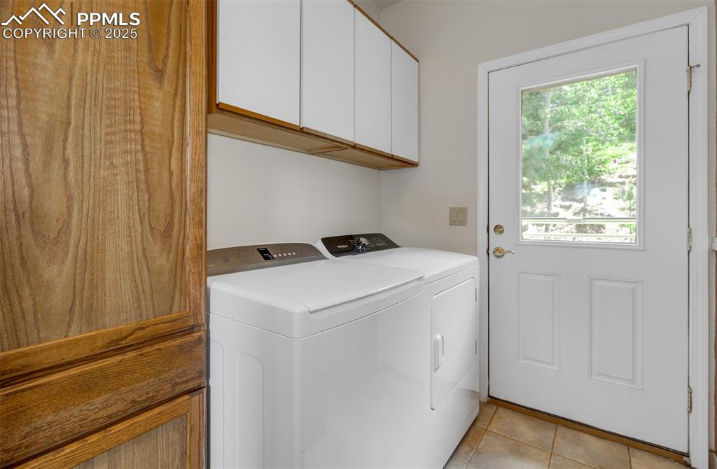 Image 22 of 46: Laundry with walk out to the back of the driveway for convenient grocery un