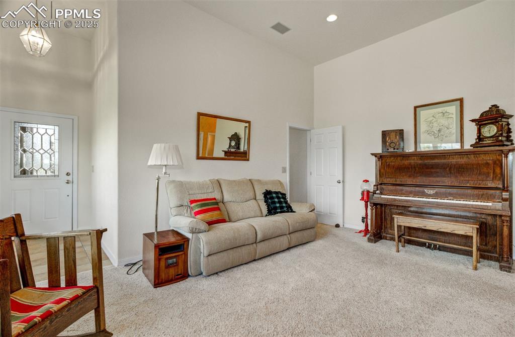 Image 30 of 46: Family room with entrance front the front and huge 4 car garage!