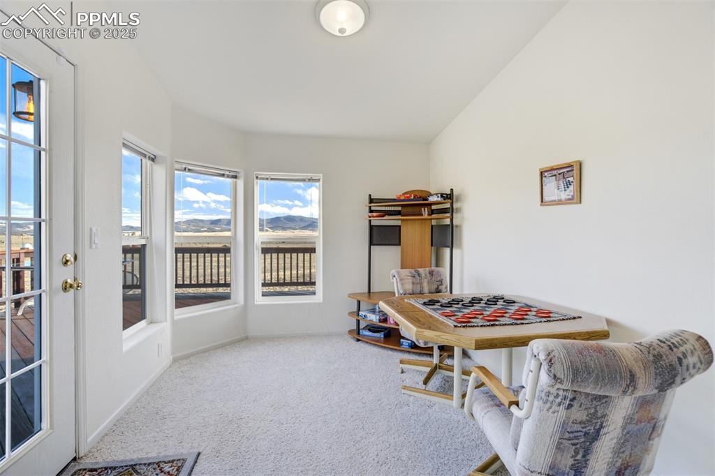 Image 12 of 46: Additional room off living room that can be used as a bright corner office,