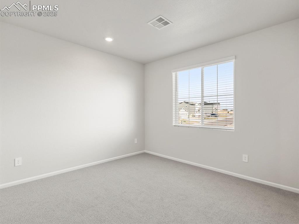 Image 17 of 28: Spare room featuring carpet floors and recessed lighting