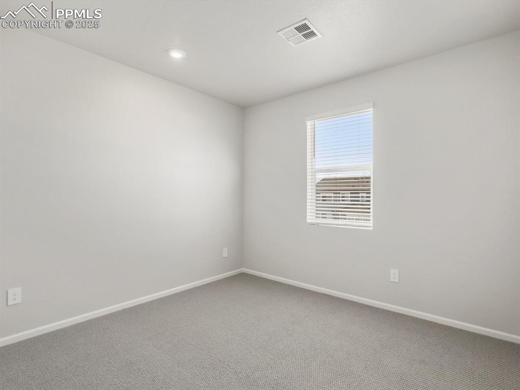 Image 20 of 28: Spare room featuring carpet and recessed lighting