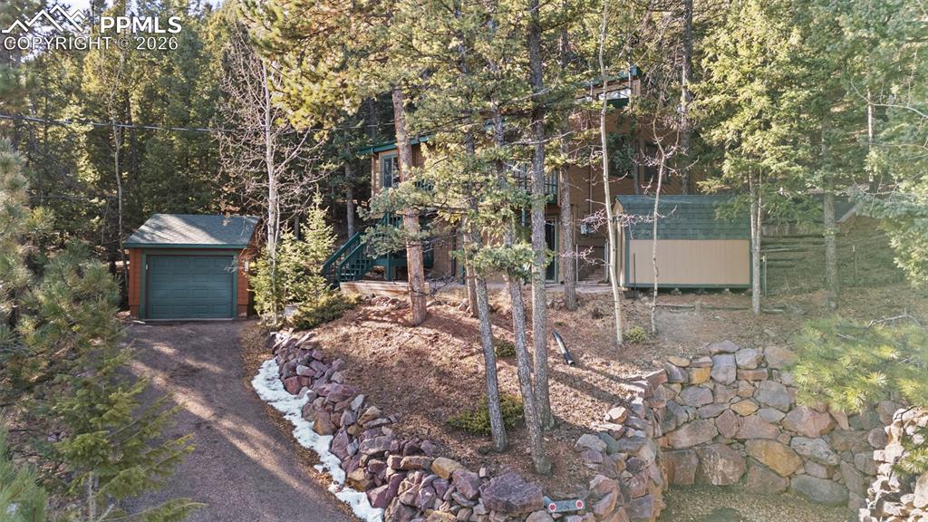 Image 3 of 32: View of Front of Home & Lot & the Detached 1 Car Garage!