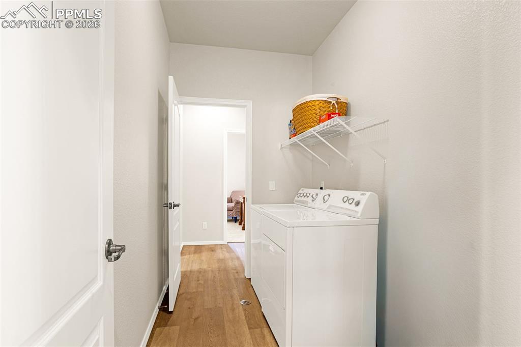 Image 15 of 42: Laundry room, washer and dryer stay