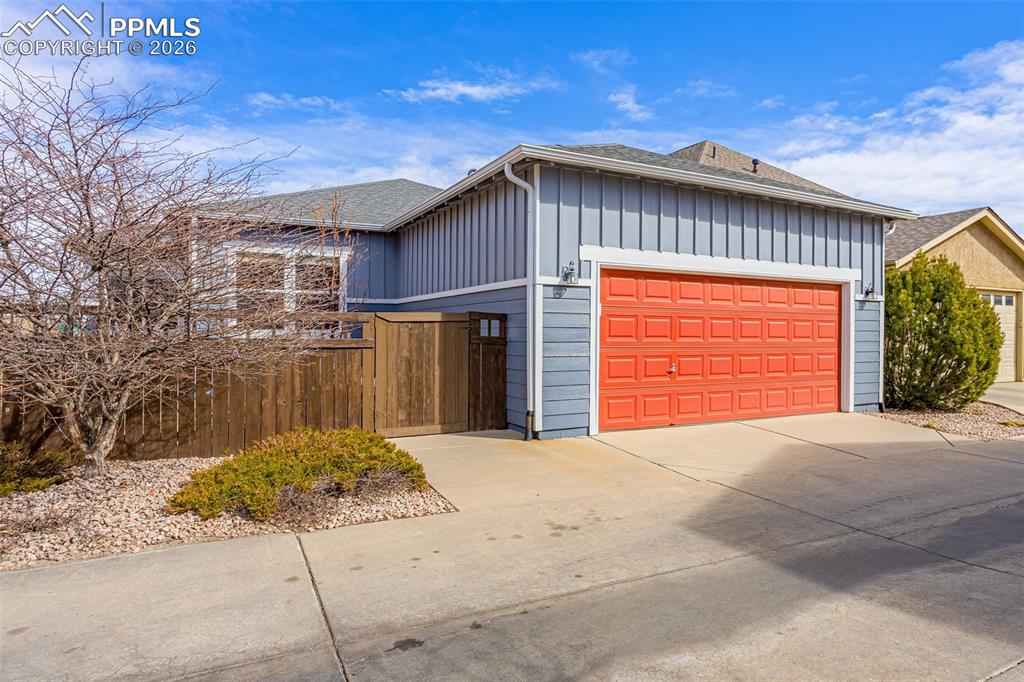 Image 33 of 42: Garage with side entrance