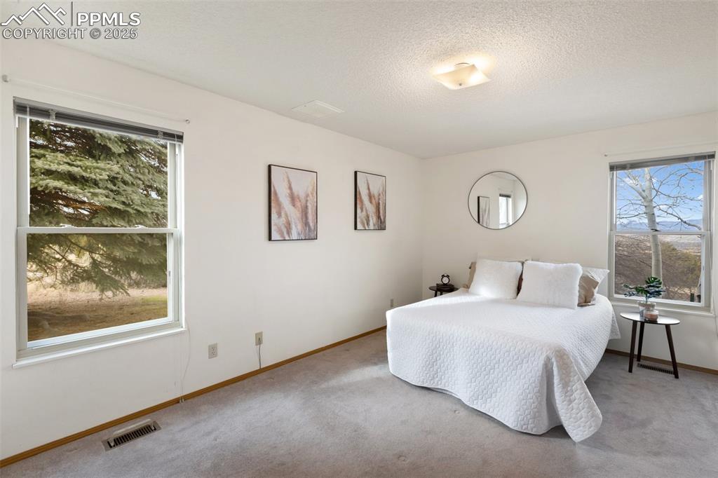 Image 19 of 50: Master Bedroom