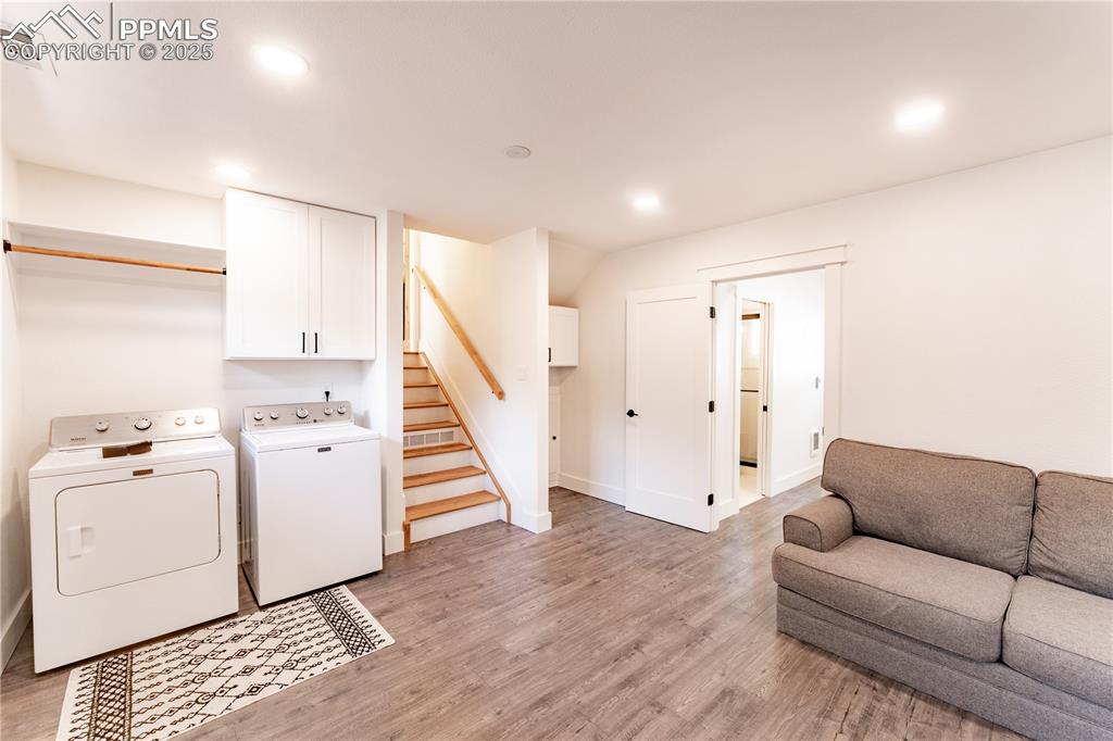 Image 23 of 39: Lower Level Laundry & Living Room Area